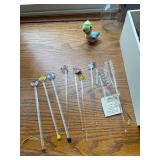 Collection of Glass Stir Sticks, Wine Charms, and Frames
