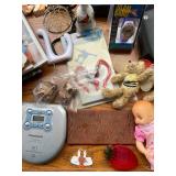 Assortment of Magazines, Quilting Book, Two Personal CD Players, and Assorted Decorative Items