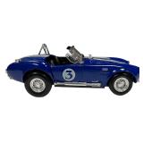 1:24 scale diecast model of a blue and white 1965 Shelby Cobra 427 S/C