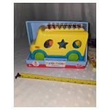 school bus toy and books