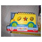 school bus toy and books