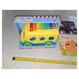 school bus toy and books