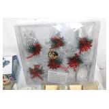 Assorted Holiday Decorations Including Santa Tin, Reindeer Figurines, and Candle Holders