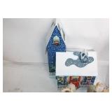 Assorted Holiday Decorations Including Santa Tin, Reindeer Figurines, and Candle Holders