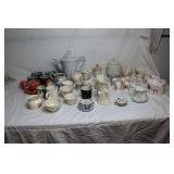 Collection of Vintage Teapots, Cups, and Serving Dishes