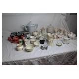 Collection of Vintage Teapots, Cups, and Serving Dishes