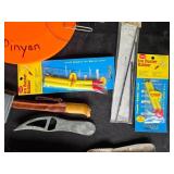 Collection of Fishing Gear Including Fillet Knives and Electric Fisherman