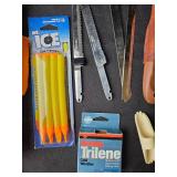 Collection of Fishing Gear Including Fillet Knives and Electric Fisherman