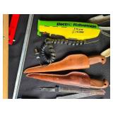 Collection of Fishing Gear Including Fillet Knives and Electric Fisherman
