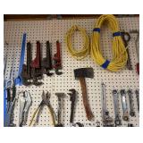 Collection of Hand Tools Including Pipe Wrenches and Claw Hammer