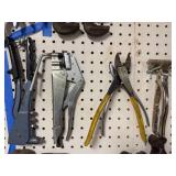 Collection of Hand Tools Including Pipe Wrenches and Claw Hammer