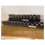 Set of Mechanics Socket Tools in Metal Racks