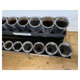 Set of Mechanics Socket Tools in Metal Racks