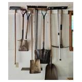 Collection of Gardening Hand Tools Including Shovels and Picks