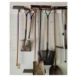 Collection of Gardening Hand Tools Including Shovels and Picks