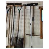 Collection of Gardening Hand Tools Including Shovels and Picks