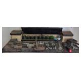 Collection of Industrial Metal Brackets, Clamps, and Glass Containers