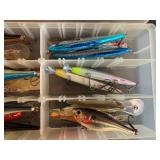 Collection of Various Fishing Lures in Tackle Box