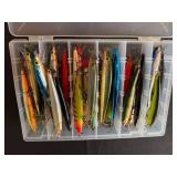 Lot of Fishing Lures in Tackle Box with various Jerk and Rogue Styles