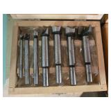 Collection of Workshop Tools and Accessories with Sanding Belts and Drill Bits