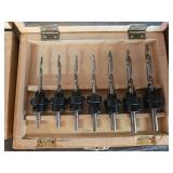 Collection of Workshop Tools and Accessories with Sanding Belts and Drill Bits