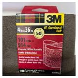 Collection of Workshop Tools and Accessories with Sanding Belts and Drill Bits