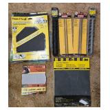 Collection of Workshop Tools and Accessories with Sanding Belts and Drill Bits