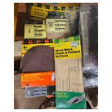 Collection of Workshop Tools and Accessories with Sanding Belts and Drill Bits