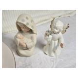 Holiday Decor and Collectibles Lot - a decorative plate with a Christmas tree design, three angel figurines, a DVD titled "Holiday Fire" featuring Christmas carols, and a 2004 Sears holiday ornament