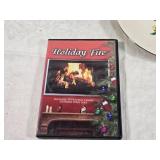 Holiday Decor and Collectibles Lot - a decorative plate with a Christmas tree design, three angel figurines, a DVD titled "Holiday Fire" featuring Christmas carols, and a 2004 Sears holiday ornament