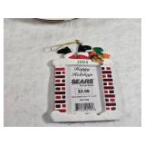 Holiday Decor and Collectibles Lot - a decorative plate with a Christmas tree design, three angel figurines, a DVD titled "Holiday Fire" featuring Christmas carols, and a 2004 Sears holiday ornament