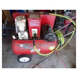 Red air compressor with Green hose