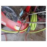 Red air compressor with Green hose