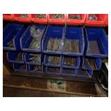 Blue and Orange Containers with hardware and Tool shop shelf
