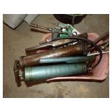 Grease guns in pink container