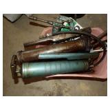 Grease guns in pink container