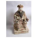 Intricately Detailed Porcelain Sculpture of Asian Deity