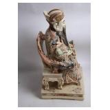 Intricately Detailed Porcelain Sculpture of Asian Deity