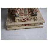 Intricately Detailed Porcelain Sculpture of Asian Deity