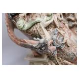 Intricately Detailed Porcelain Sculpture of Asian Deity