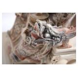 Intricately Detailed Porcelain Sculpture of Asian Deity