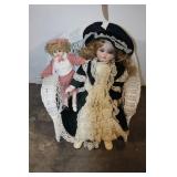 Set of 2 Porcelain Dolls on Wicker Chair