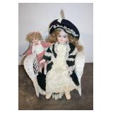 Set of 2 Porcelain Dolls on Wicker Chair