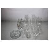 Collection of Various Glassware Including Beer Mugs, Wine Goblets, and Serving Dish