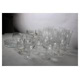 Collection of Various Glassware Including Beer Mugs, Wine Goblets, and Serving Dish