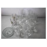 Collection of Various Glassware Including Beer Mugs, Wine Goblets, and Serving Dish