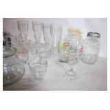Assorted Glassware Collection Featuring Vases, Cups, and Jars