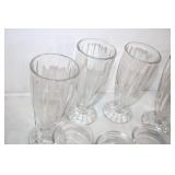 Assorted Glassware Collection Featuring Vases, Cups, and Jars