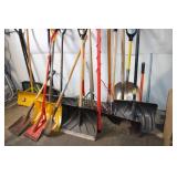 Collection of Assorted Snow Shovels, Spades, and Garden Tools