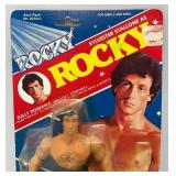 Est. $200.00 - $300.00 1983 PAC Phoenix Toys ROCKY Sylvester Stalllone As Rocky Fully poseable Doll On Original Card (New Old Stock) Missing Belt  Packaging Shows Wear